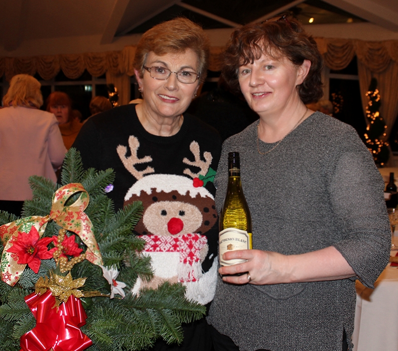 Mary and Catherine holding their raffle prizes