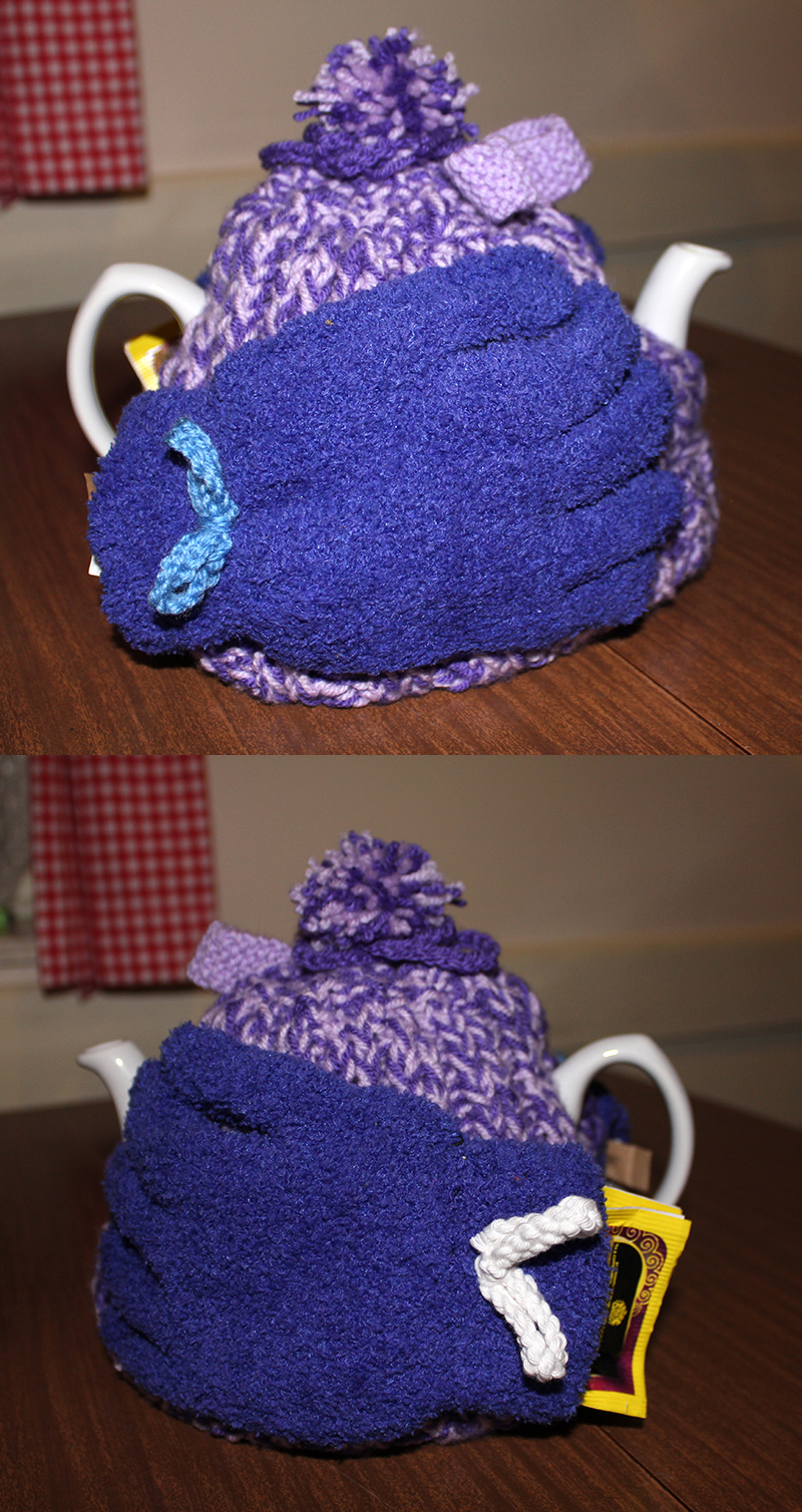 Mary DeCourcy's purple tea cosy with gloves on either side
