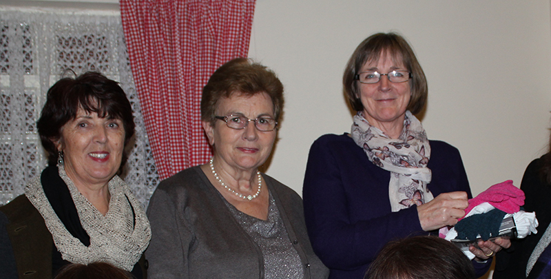 Christina and Mary with Margaret, who is holding some of the socks gloves and scarves for migrants and refugees on Lesbos