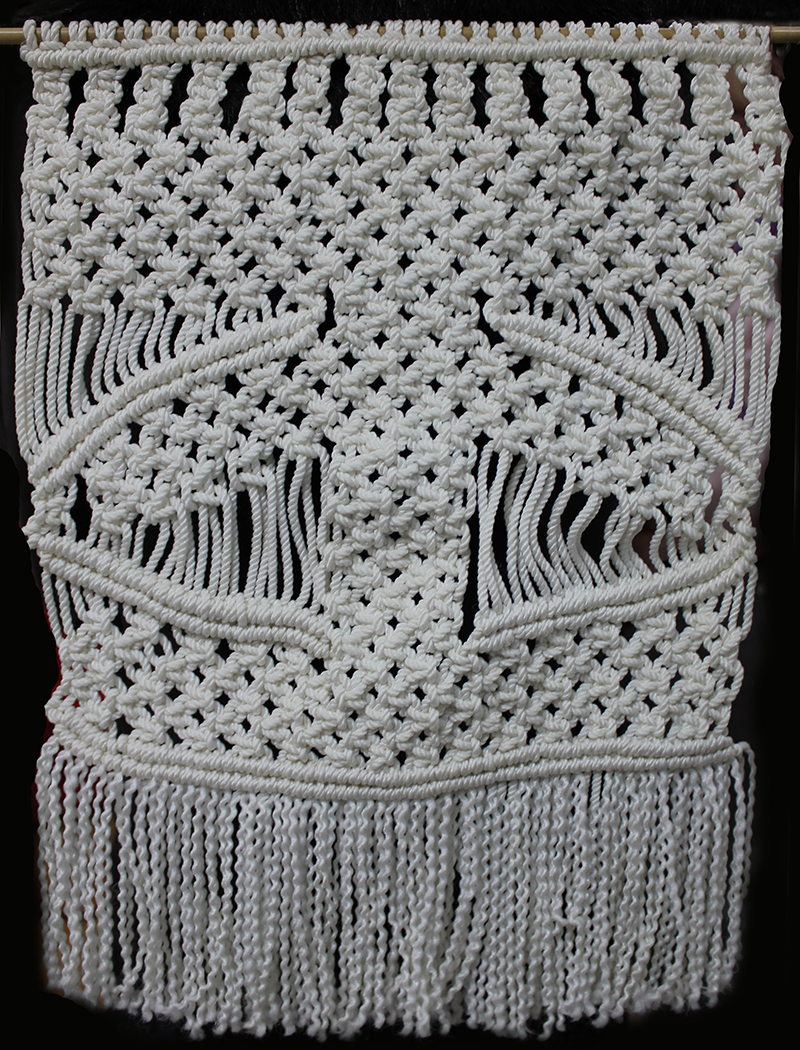 A Macrame wall hanging by Statia Ivers