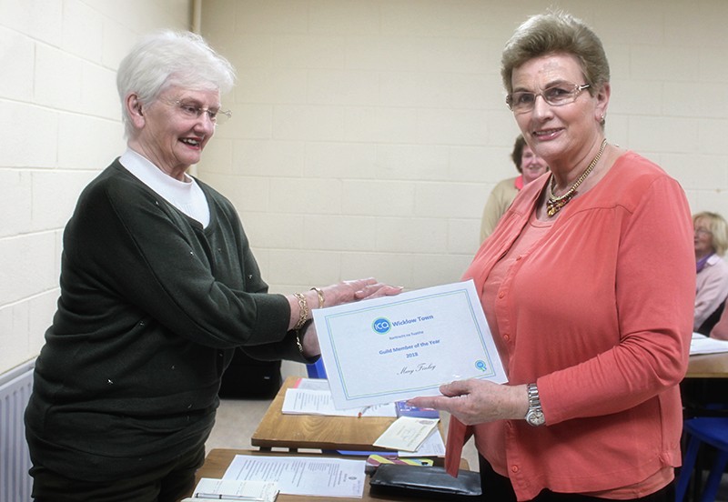 Betty Teahan handing Mary her Certificate
